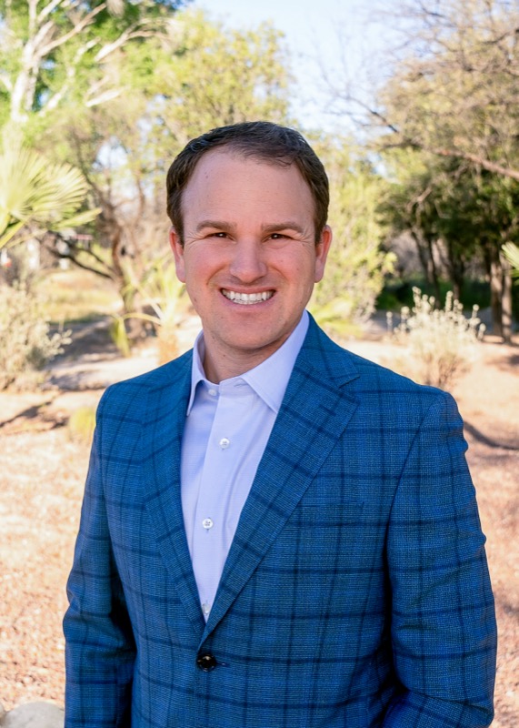 Man in a blue suite in the desert